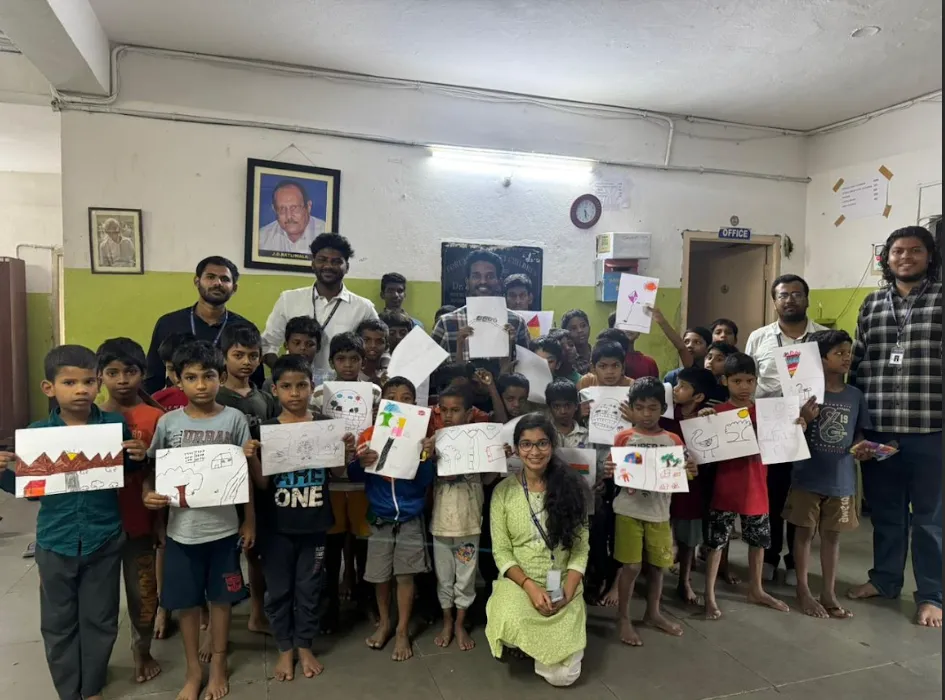 SSIM students conducting a drawing activity with children at a community centre