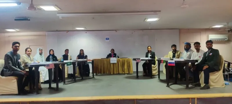 SSIM students seated behind country placards during a Mock United Nations session