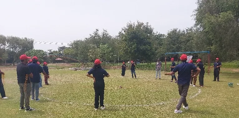 SSIM students taking part in an outdoor team-building activity during outbound training