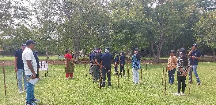 SSIM students working through a group problem-solving task during outbound training